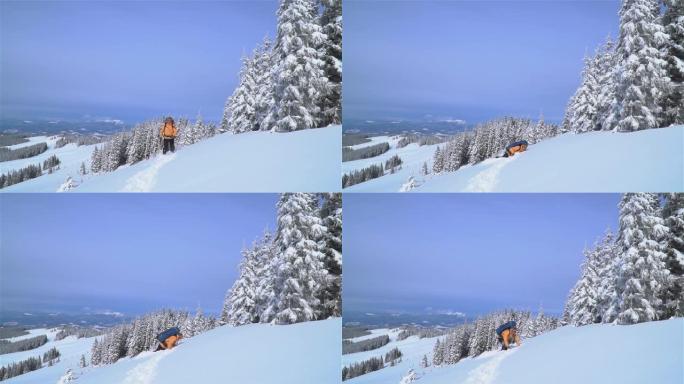 一位游客在山上的雪中漫步。