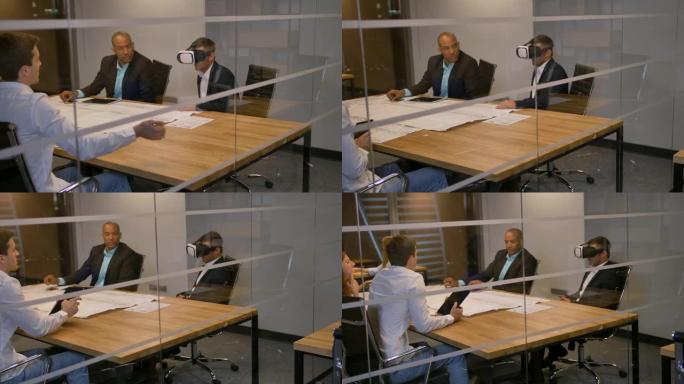 商业团队坐在桌子旁，戴着虚拟现实护目镜的人。人们在办公室测试vr眼镜