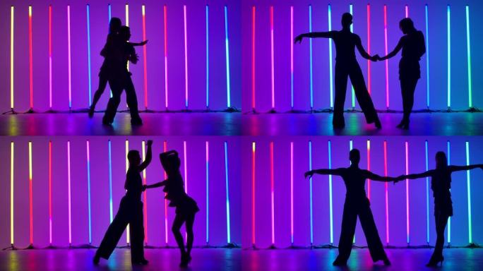 一对舞者正在跳一支充满激情的拉丁美洲舞蹈。伦巴，桑巴，茶茶，吉夫。在明亮的彩色霓虹灯的背景下，舞者的