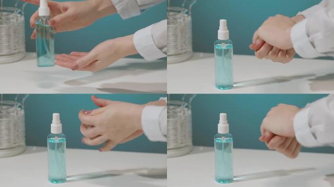 女人的手拿一个装有液体消毒剂的瓶子，并将其涂在手上，以保护自己免受细菌感染。