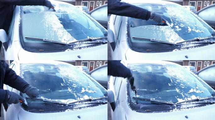 手从车窗上刮冰