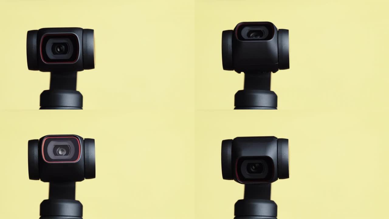 机械万向节相机镜头在黄色背景上旋转，机器人相机微距