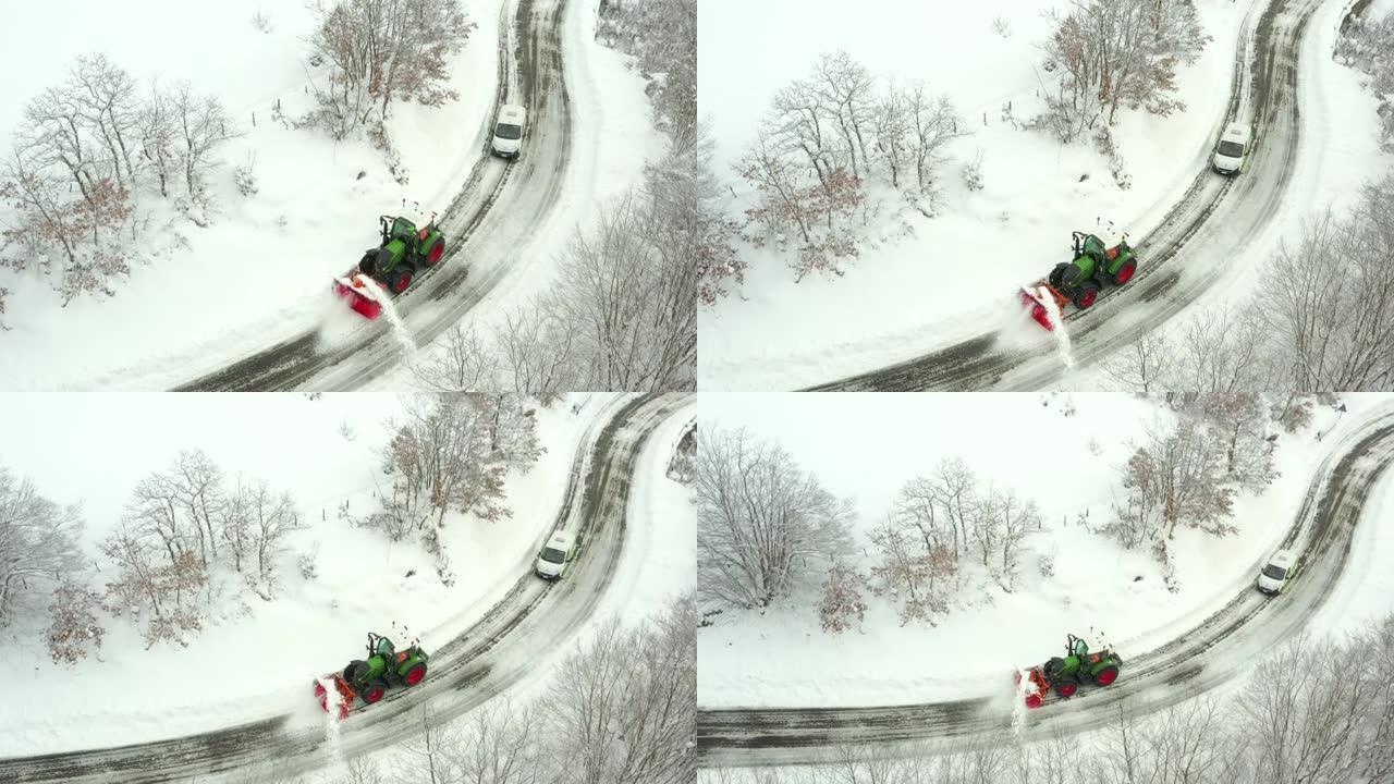 大雪过后，吹雪机从山区道路上除雪