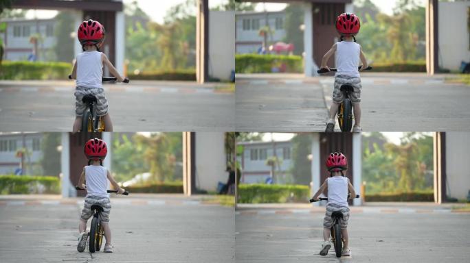 快乐的孩子在公园骑平衡自行车