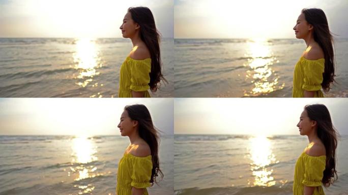 美丽的女人在日落时在海滩海洋周围放松，休闲旅游和度假