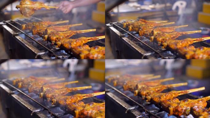 泰国街头小吃热炉上旋转的鸡肉烤架