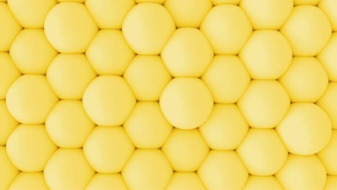 抽象3d造型柔和的黄色球墙动画。4k循环镜头。