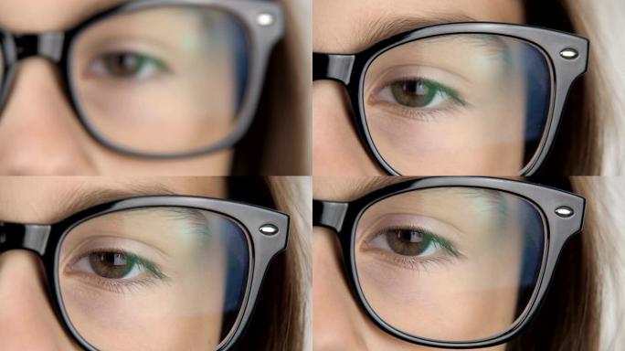 一个戴眼镜的女孩的眼睛。