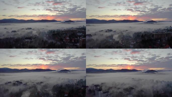 雾在日落时降临在城市。