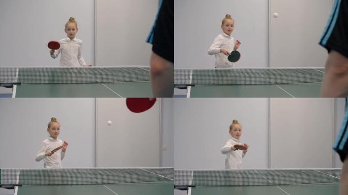 打乒乓球慢动作的年轻女孩。运动少女打乒乓球
