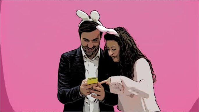 粉红色背景的年轻情侣。头上有贪婪的耳朵。在这张复活节照片中，我在手机上做了sephi，看着他们笑。动