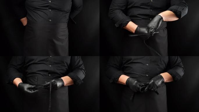高加索人的成年男子穿上黑色厨师的围裙