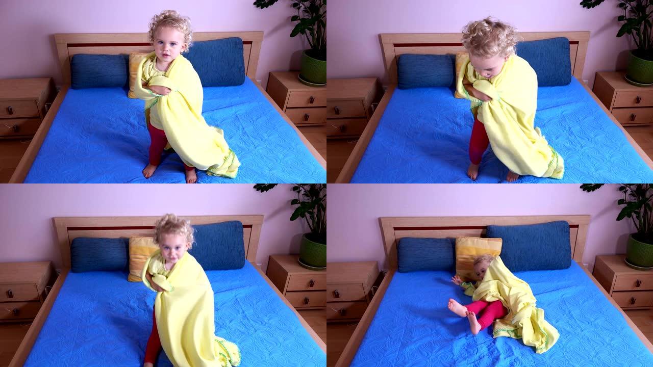 女婴跳到床上裹着格子。