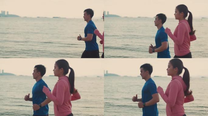 健身情侣在美丽的日出期间沿着海滩跑步运动训练健康的生活方式理念，积极的运动锻炼锻炼生活方式。
