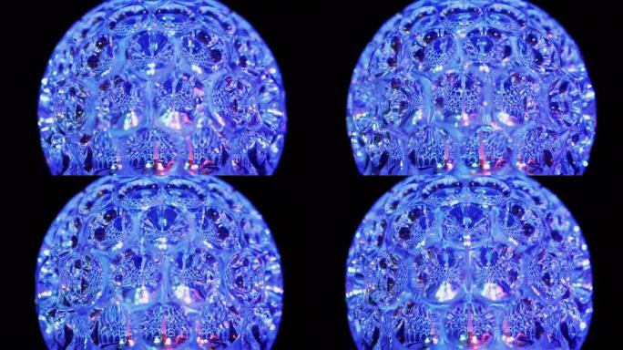旋转发光二极管迪斯科球在黑暗中发光霓虹灯。特写。4K