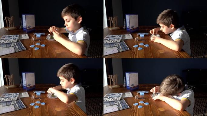 孩子在桌子上做拼图，4k分辨率