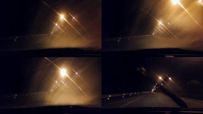 在智能手机慢动作拍摄的夜间道路上行驶