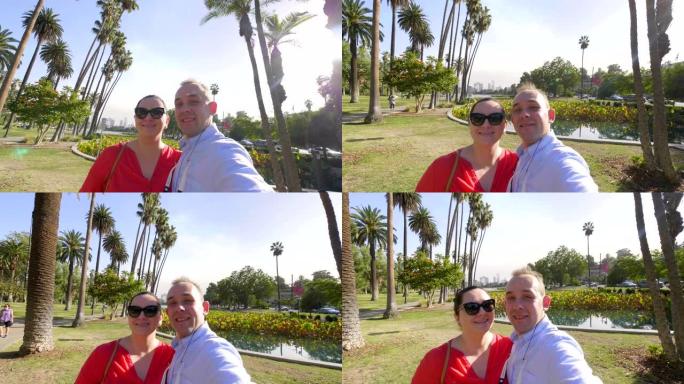 一对夫妇在洛杉矶回声公园以4k慢动作60fps的速度在慢动作中自拍并欣赏市中心
