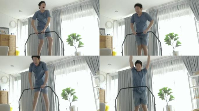 快乐的亚洲男孩跳上迷你蹦床在家附近的窗户，呆在家里活动理念。