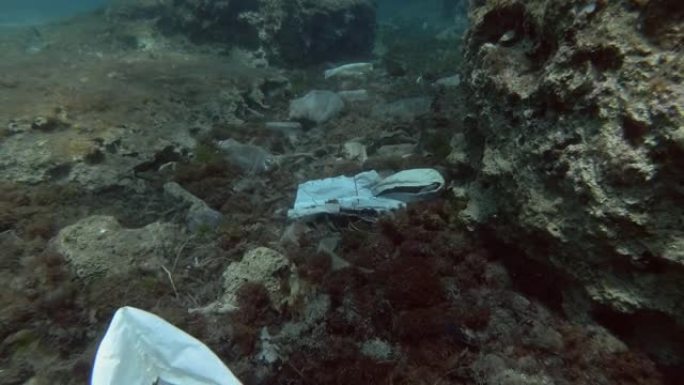 塑料污染，海底有很多塑料。慢动作，瓶子，袋子和其他塑料碎片在海底。欧洲地中海的塑料垃圾环境污染问题。