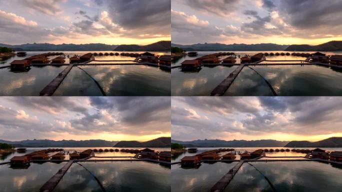 日落时分，在北碧的阿南塔河山，漂浮在斯利那卡琳大坝上的木筏度假胜地