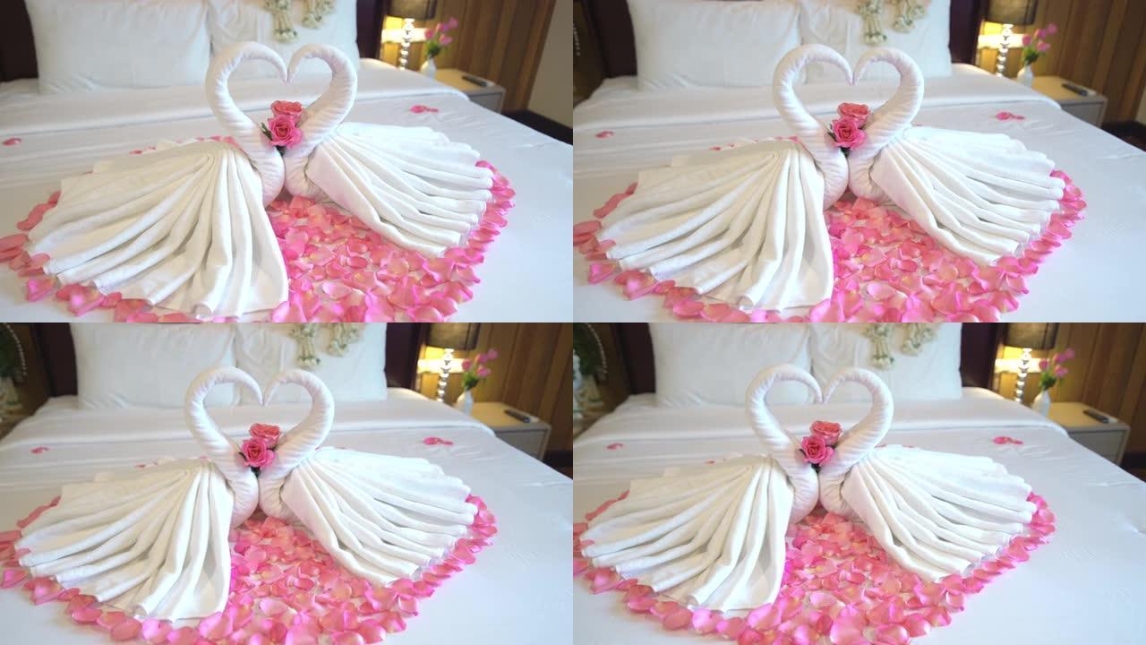 卧室室内情人床上天鹅毛巾装饰的4k多莉镜头
