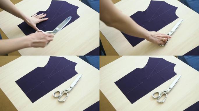 女裁缝手的上视图，将剪刀放在织物模板旁边