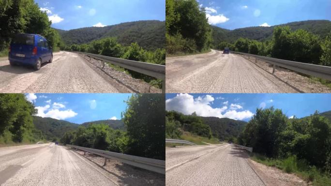 驾驶汽车穿越塞尔维亚东部美丽的绿色景观和峡谷。通往山顶的路，攀登