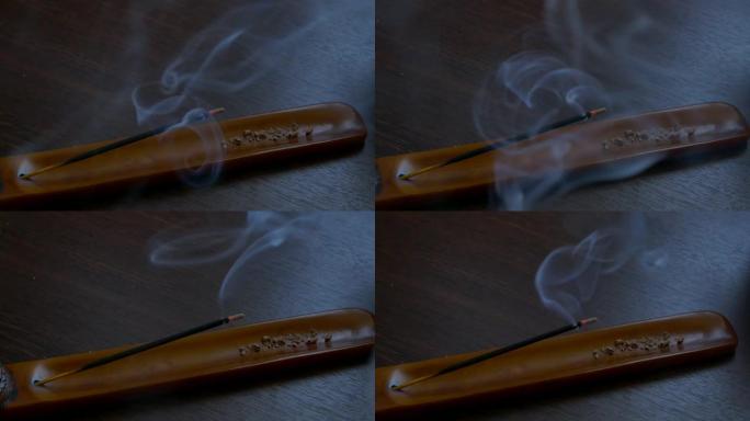 香棒燃烧iindian agarbatti烟熏香气香架燃烧香棒烟熏动态美丽平静放松概念香木桌上