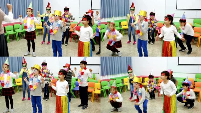 快乐的孩子和女老师在教室里一起跳舞