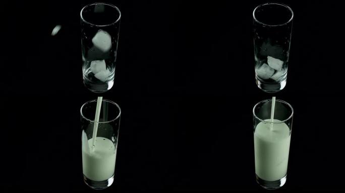 将冰块扔进玻璃杯中，然后装满酸奶，开菲尔，牛奶，乳制品是新鲜的，冷藏的。特写，在黑色背景上。