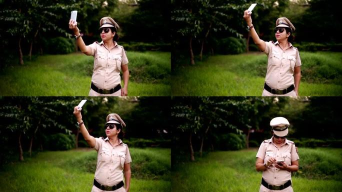警察妇女使用智能手机进行自拍照