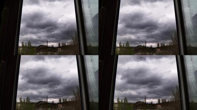 雷雨云在窗外的天空中飞翔