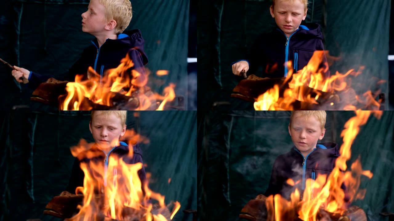 小男孩喜欢篝火