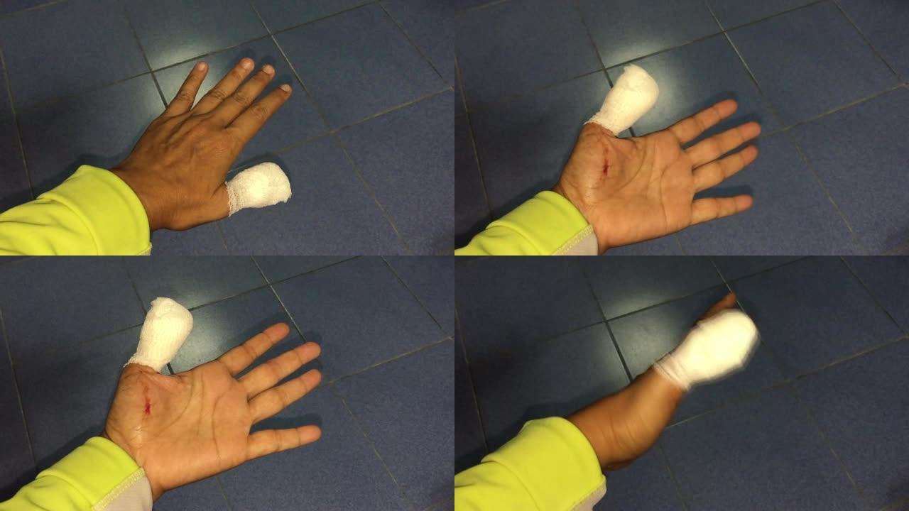 亚洲妇女用绷带受伤的手指
