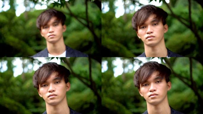 年轻的日本男子与严肃的面部表情肖像