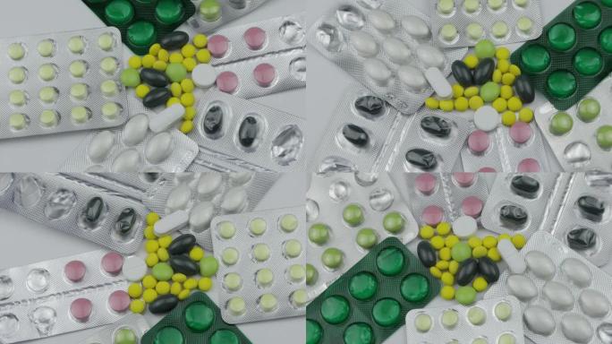 许多旋转药丸和药物。药丸和药片，泡罩包装转动