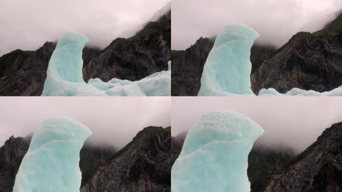 新西兰雾中的山脉背景上的冰川。