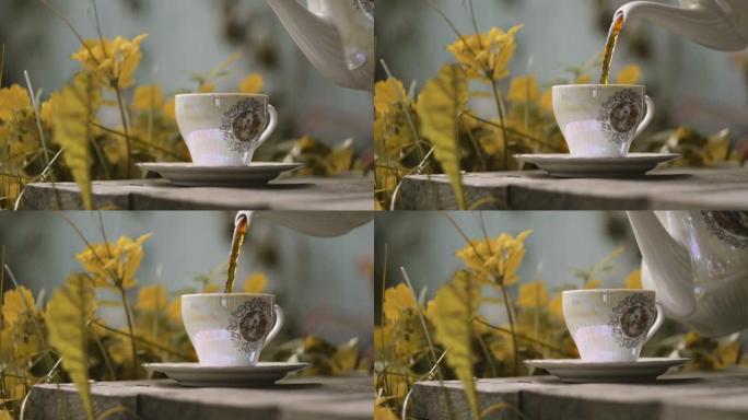 将热茶倒入自然的瓷器珍珠母老式杯子中