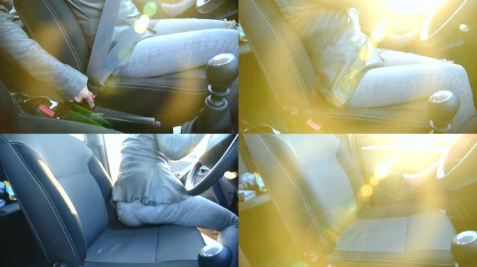 动作女孩的特写镜头到达后解开车内的安全带