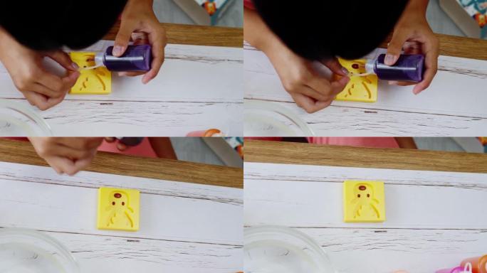 快乐的亚洲女孩在家玩水泥成型玩具，生活方式理念。