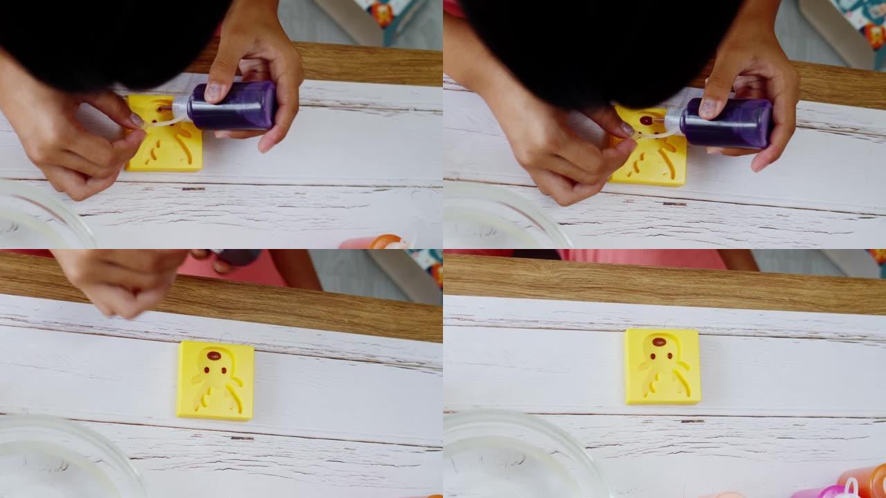 快乐的亚洲女孩在家玩水泥成型玩具，生活方式理念。