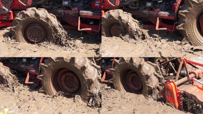 拖拉机正在努力拍打土壤并将其与水混合以种植谷物
