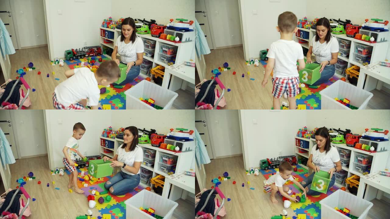 小男孩帮助母亲从玩具中打扫房间