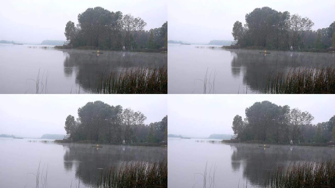乡村地区湖上雾蒙蒙的渔夫。4K