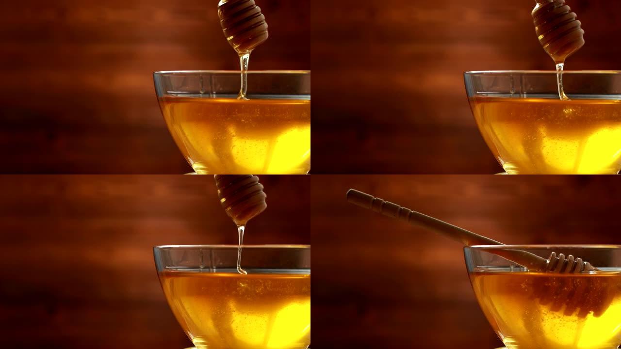 碗里美味健康的蜂蜜从木棒上流下蜂蜜，复制空间，有机