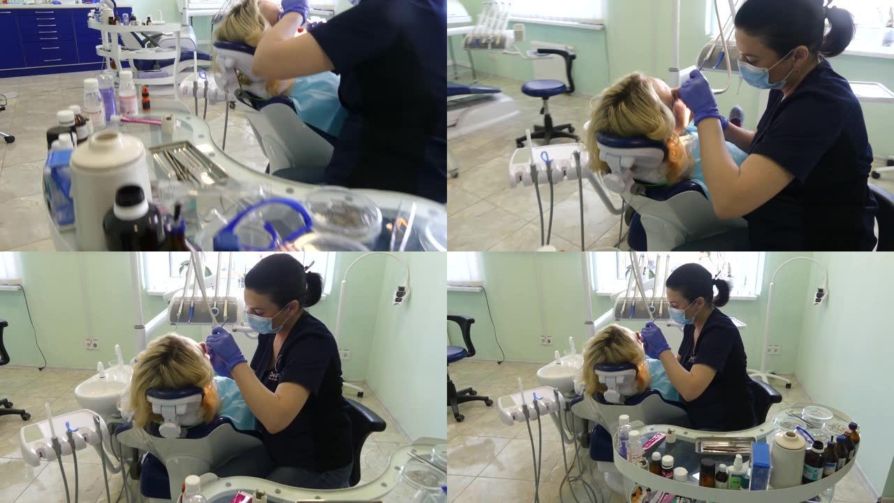 牙医招待会上的女孩。牙医在牙科诊所为病人治疗牙齿。