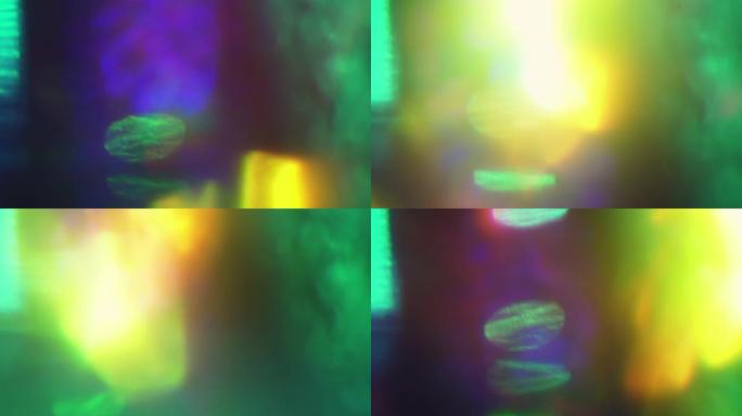 五颜六色的彩虹光形成在空间中随机移动。节日过渡，花哨的叠加镜头