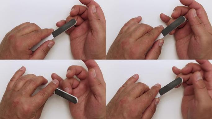 特写男人用指甲锉治疗指甲。