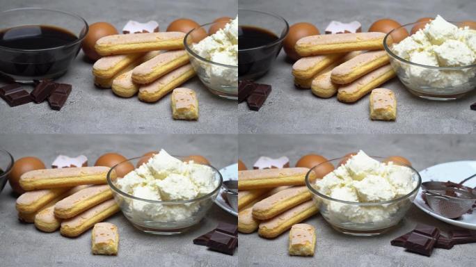 烹饪提拉米苏-萨瓦亚迪饼干、马斯卡彭、奶油、糖、可可的配料